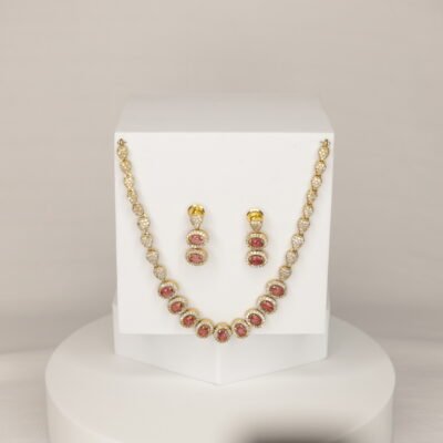 Elegant gold-plated necklace set with oval Red stones and cubic zirconia sparkle