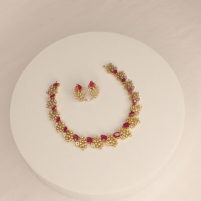 Timeless beauty — Adorned with red heart-shaped stones and floral elegance.