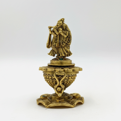 Brass Radha Krishna Kunguma Chimil (vermilion pot) at Kulali Collections. ​